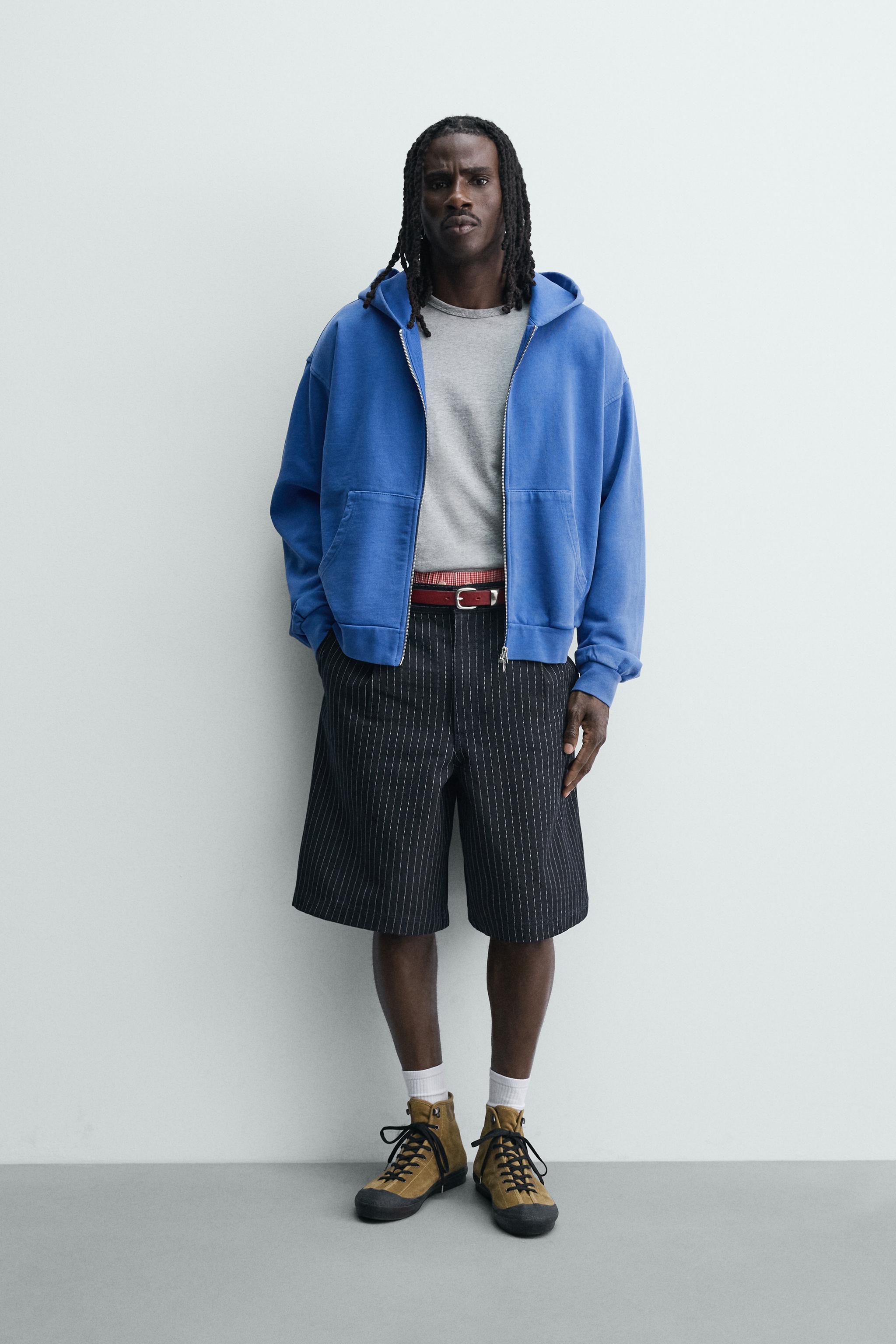 PINSTRIPED PLEATED SHORTS